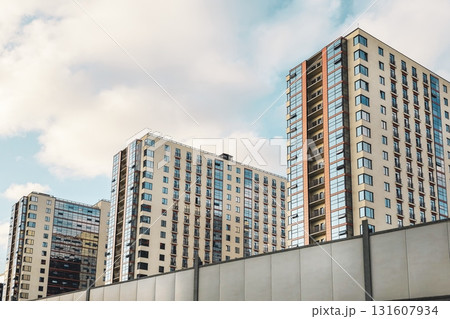 New apartment building with colorful facade and street 131607934