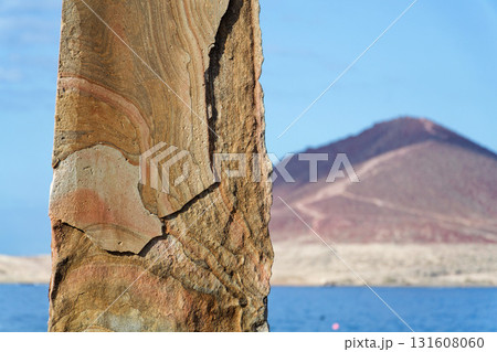 Stone needle sculpture Aguja Piedra El Medano on Tenerife coast, Canary Islands, Spain, sunny summer day Stone needle sculpture Aguja Piedra El Medano on Tenerife coast, Canary Islands, Spain, sunny summer day 131608060