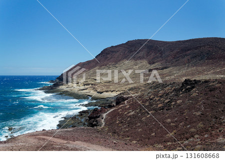 Dramatic cliffs around Montana Bocinegro and Montana Roja mountain, Tenerife coast near El Medano, Canary Islands, Spain, sunny summer day Dramatic cliffs around Montana Bocinegro and Montana Roja mountain, Tenerife coast near El Medano, Canary Islands, Spain, sunny summer day 131608668