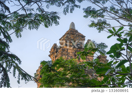 Ancient sacred Cham Tower of 12 century overgrown with tropical trees in Tuy Hoa, Vietnam 131608691