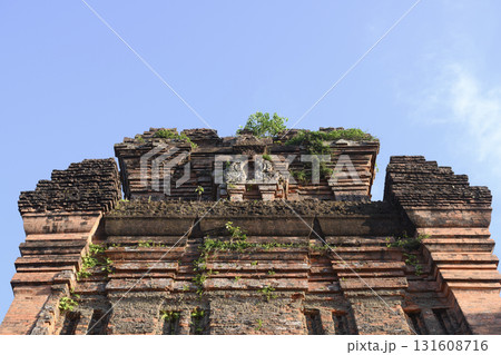 Ancient sacred Cham Tower of 12 century overgrown with grass and small trees in Tuy Hoa, Vietnam 131608716