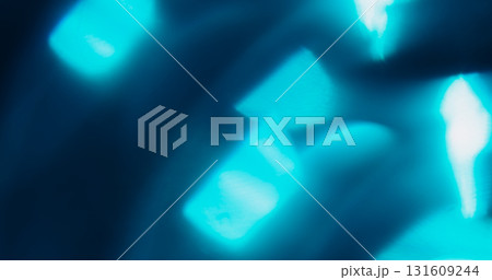 Glow leak. Defocused glow texture. Vibrant blue color gleam optical lens flare shiny flash on abstract luminous visual art background. Glow leak. Defocused glow texture. Vibrant blue color gleam optical lens flare shiny flash on abstract luminous visual art background. 131609244