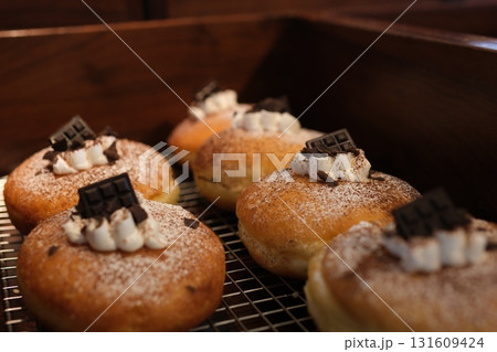 doughnuts scene - mix of multicolored sweet donuts with sprinkel on blue background 131609424