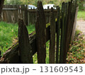 old wooden green fence fence next to the house 131609543