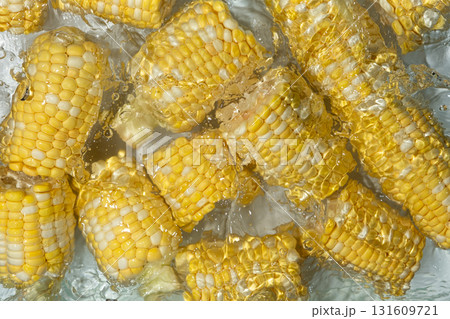Aesthetic summer bright background of fresh ripe corn cob in water. Aesthetic summer bright background of fresh ripe corn cob in water. 131609721