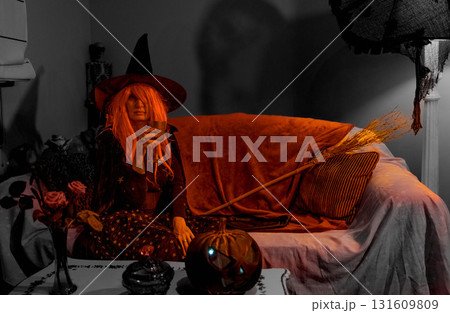 Witch with Halloween Pumpkin Doing Magic 131609809