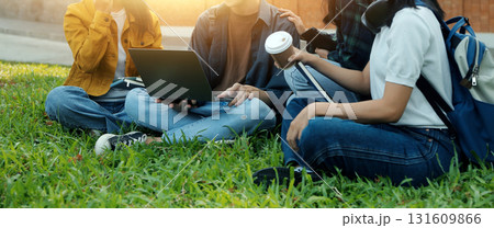 Happy students walking together on university campus, chatting and laughing outdoors after classes Happy students walking together on university campus, chatting and laughing outdoors after classes 131609866