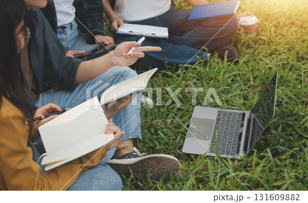 Happy students walking together on university campus, chatting and laughing outdoors after classes Happy students walking together on university campus, chatting and laughing outdoors after classes 131609882