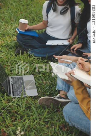 Happy students walking together on university campus, chatting and laughing outdoors after classes Happy students walking together on university campus, chatting and laughing outdoors after classes 131609883