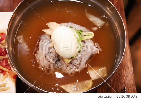 Korean cold noodles in chilled broth 131609938