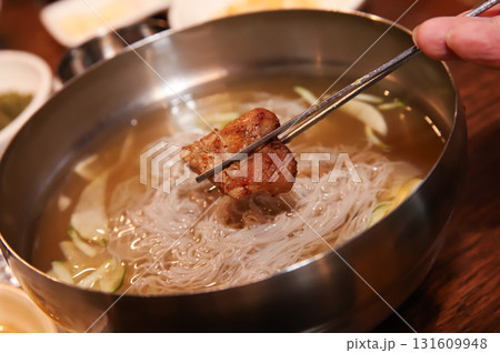 Korean cold noodles in chilled broth Korean cold noodles in chilled broth 131609948