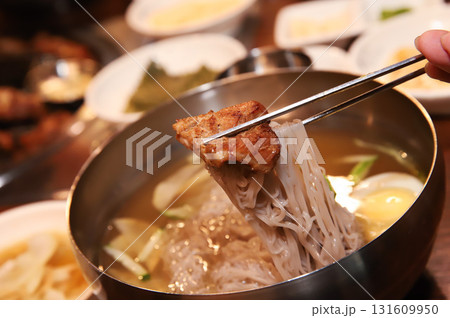 Korean cold noodles in chilled broth 131609950