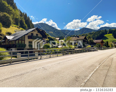 Traditional European Village with Charming Houses in Mountain Nature 131610283