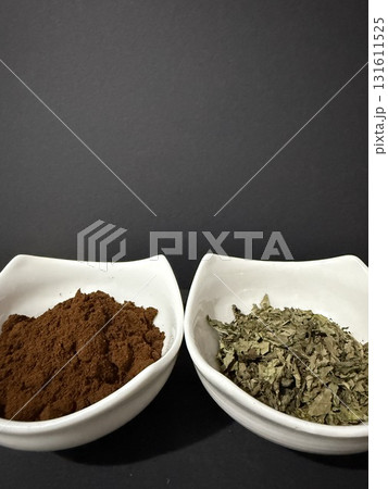 Bowls of coffee and mint tea on dark background. Bowls of coffee and mint tea on dark background. 131611525