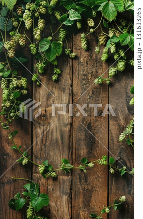 Closeup of fresh green hop cones and leaves on an aged wooden table,  for beer branding and product designs. 131613265