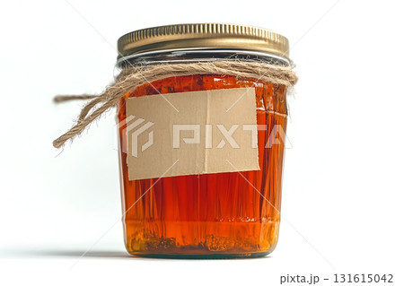 Glass jar with natural honey and rustic twine on white background for culinary use Glass jar with natural honey and rustic twine on white background for culinary use 131615042