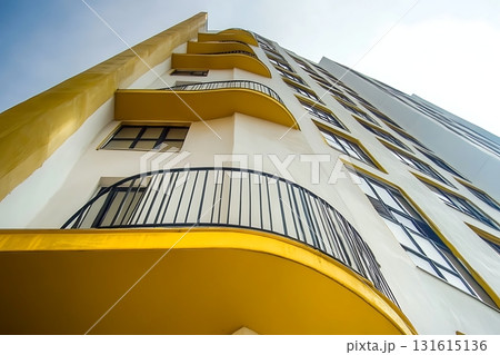 Modern Architectural Building with Curved Balconies and Clear Sky in Urban Environment 131615136