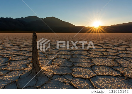 Stunning Sunset Over Salt Flats with Dramatic Landscape and Cracked Earth Texture Stunning Sunset Over Salt Flats with Dramatic Landscape and Cracked Earth Texture 131615142