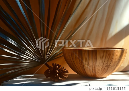 Wooden Bowl with Natural Patterns and Tropical Leaves against a Warm Textured Background 131615155