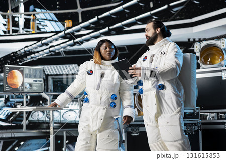 Cosmonauts in spaceship navigating orbital trajectory, doing Mars expedition for future of mankind. Astronauts mapping unknown worlds, exploring red planet to support human life beyond Earth Cosmonauts in spaceship navigating orbital trajectory, doing Mars expedition for future of mankind. Astronauts mapping unknown worlds, exploring red planet to support human life beyond Earth 131615853