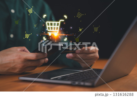 Customer using smartphone and credit card with digital shopping cart icon, symbolizing e-commerce, mobile payment, and online retail business. Concept of digital marketing, internet shopping. 131616288