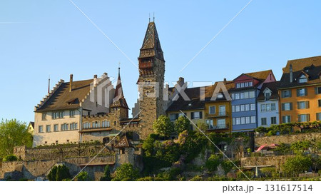 Historic castle overlooking scenic waterfront in quaint town during golden hour Historic castle overlooking scenic waterfront in quaint town during golden hour 131617514