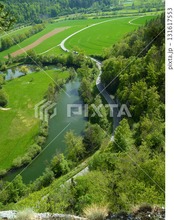 Stunning aerial view of winding river through lush green landscape in summer 131617553