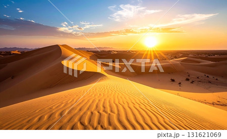 Sahara sunset paints the sand dunes in a fiery orange glow, highlighting the arid landscape for a memorable travel adventure Sahara sunset paints the sand dunes in a fiery orange glow, highlighting the arid landscape for a memorable travel adventure 131621069