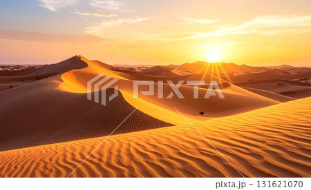 Sahara sunset paints the sand dunes in a fiery orange glow, highlighting the arid landscape for a memorable travel adventure 131621070
