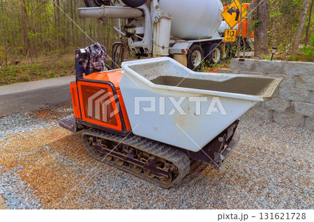 Compact tracked dumper is ready to transport concrete on construction site Compact tracked dumper is ready to transport concrete on construction site 131621728