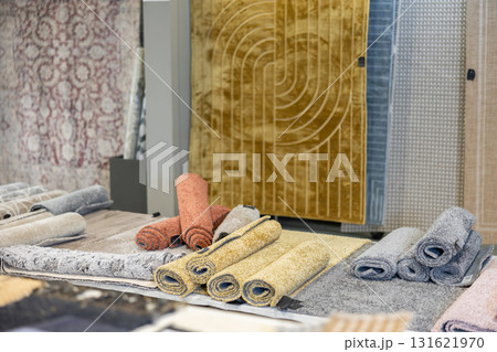 Shop window presents several carpet options, different sizes and colors. 131621970