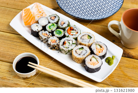 On table there portion set with maki - uramaki and nigiri On table there portion set with maki - uramaki and nigiri 131621980