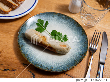 Fried pork sausage served on platter Fried pork sausage served on platter 131622041