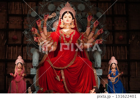 Vibrant Goddess Durga Idol with Golden Chalchitra and Family in Pandal 131622401