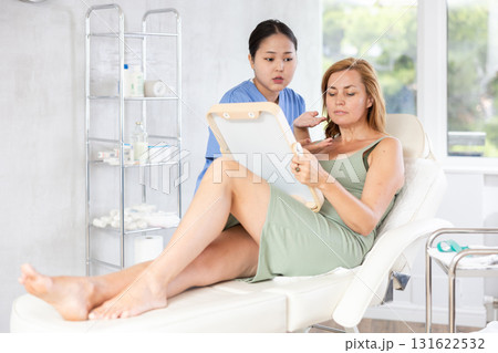 young doctor consulting with mirror young doctor consulting with mirror 131622532