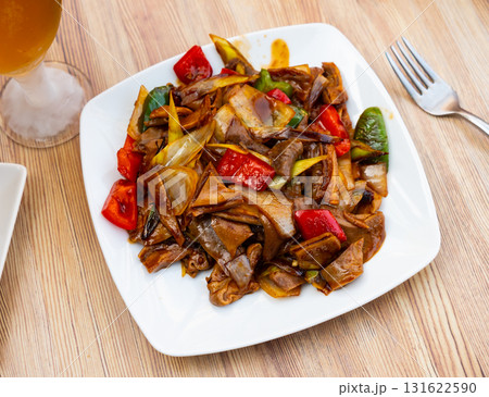 Stewed pork with pepper and green onions is traditional dish of Chinese cuisine 131622590