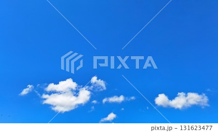Beautiful Blue Sky with Fluffy White Clouds for Natural Scenic Background 131623477