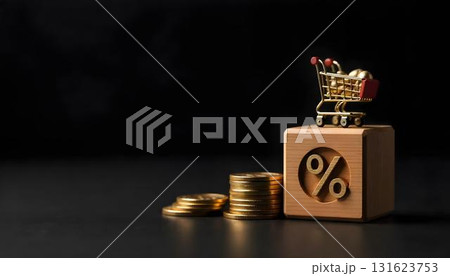 Toy shopping cart filled with coins on a black background, symbolizing online shopping and holiday sales 131623753