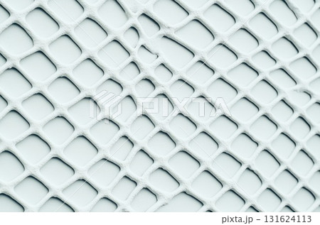 A detailed view of a textured surface displaying an intricate geometric pattern 131624113