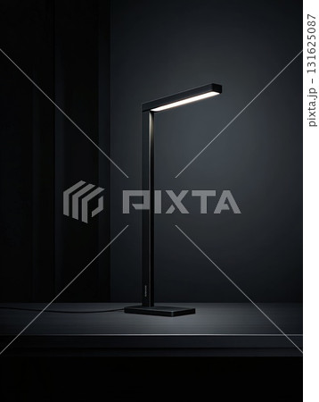 Contemporary Black Desk Lamp Illuminating Against Dark Background in Studio With Modern Minimalist Design and Vertical Stand Contemporary Black Desk Lamp Illuminating Against Dark Background in Studio With Modern Minimalist Design and Vertical Stand 131625087