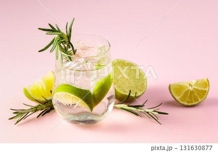 Summer refreshing drink with ice, lime and rosemary. Summer refreshing drink with ice, lime and rosemary. 131630877