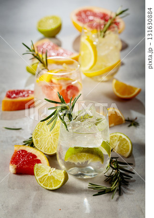 Summer refreshing drinks with ice, citrus and rosemary. 131630884