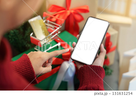 Pointing at Smartphone for Holiday Shopping 131631254