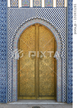 Brass door with Arabic calligraphy and Moroccan zellij mosaic tilework. Royal Palace, Fez, Morocco 131631281