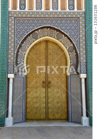 Brass door with Arabic calligraphy and Moroccan zellij mosaic tilework. Royal Palace, Fez, Morocco 131631286