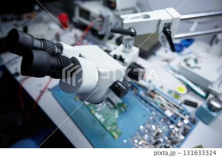 A detailed view of a sophisticated microscope used for repairing electronic circuits and components A detailed view of a sophisticated microscope used for repairing electronic circuits and components 131633324