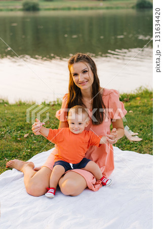 Smiling Mother And Toddler Outdoors Smiling Mother And Toddler Outdoors 131634420