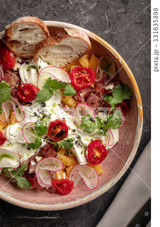 Colorful vegetable salad with radish and tomatoes 131635898