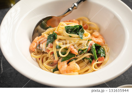 Creamy pasta with shrimp and spinach Creamy pasta with shrimp and spinach 131635944