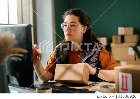 Woman working in a warehouse Woman working in a warehouse 131636920